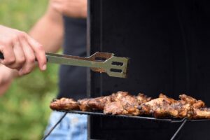 man grilling in his luxury outdoor kitchen in the gta