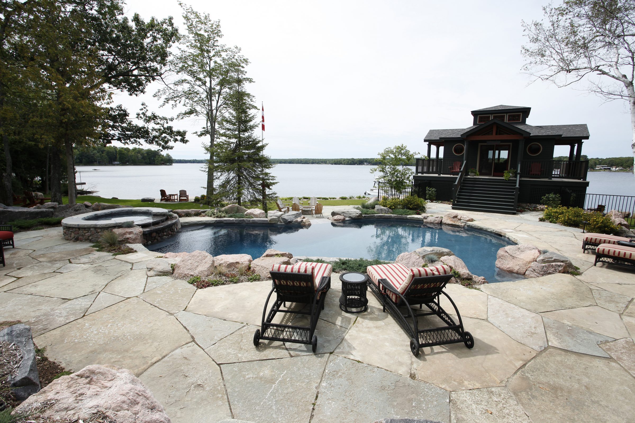 Lakeside patio with pool and modern cabin