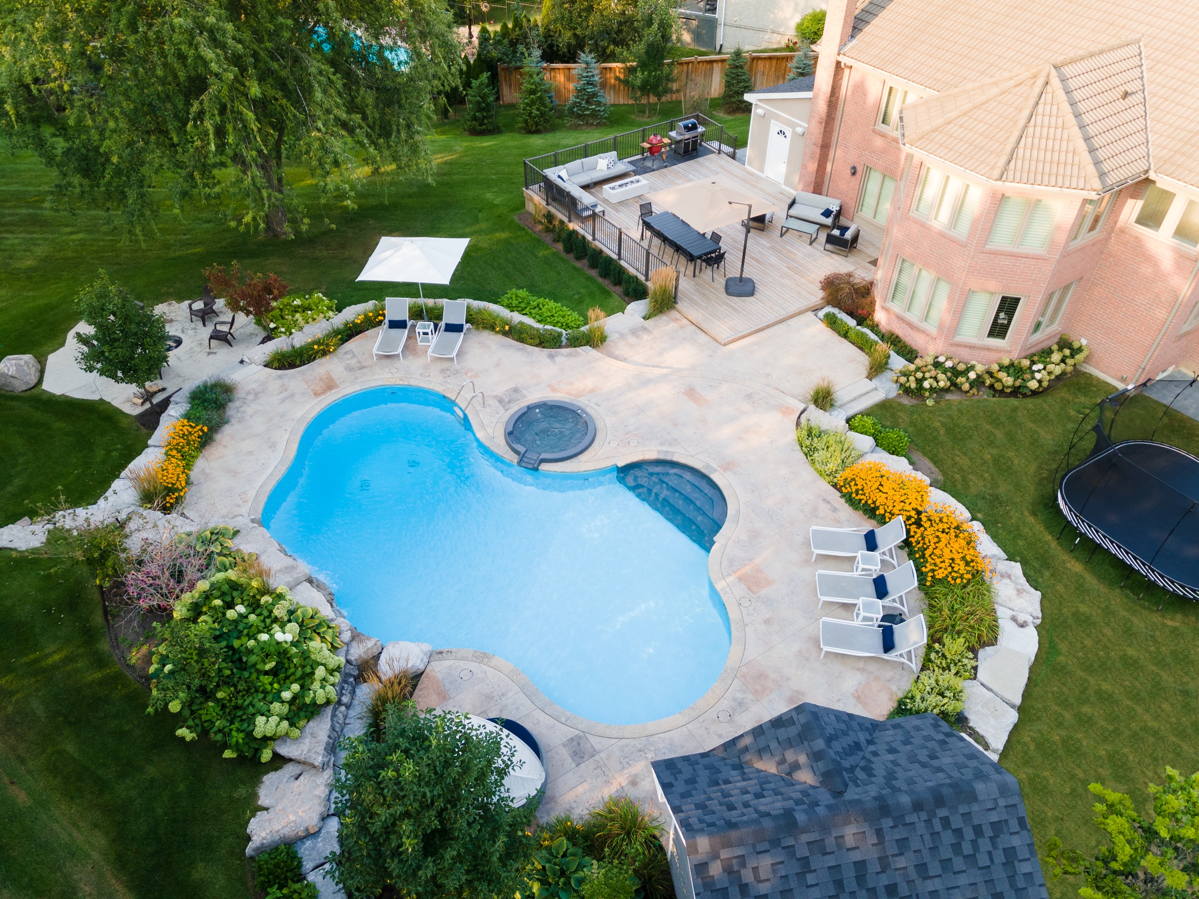 Aerial view of backyard pool and patio area.