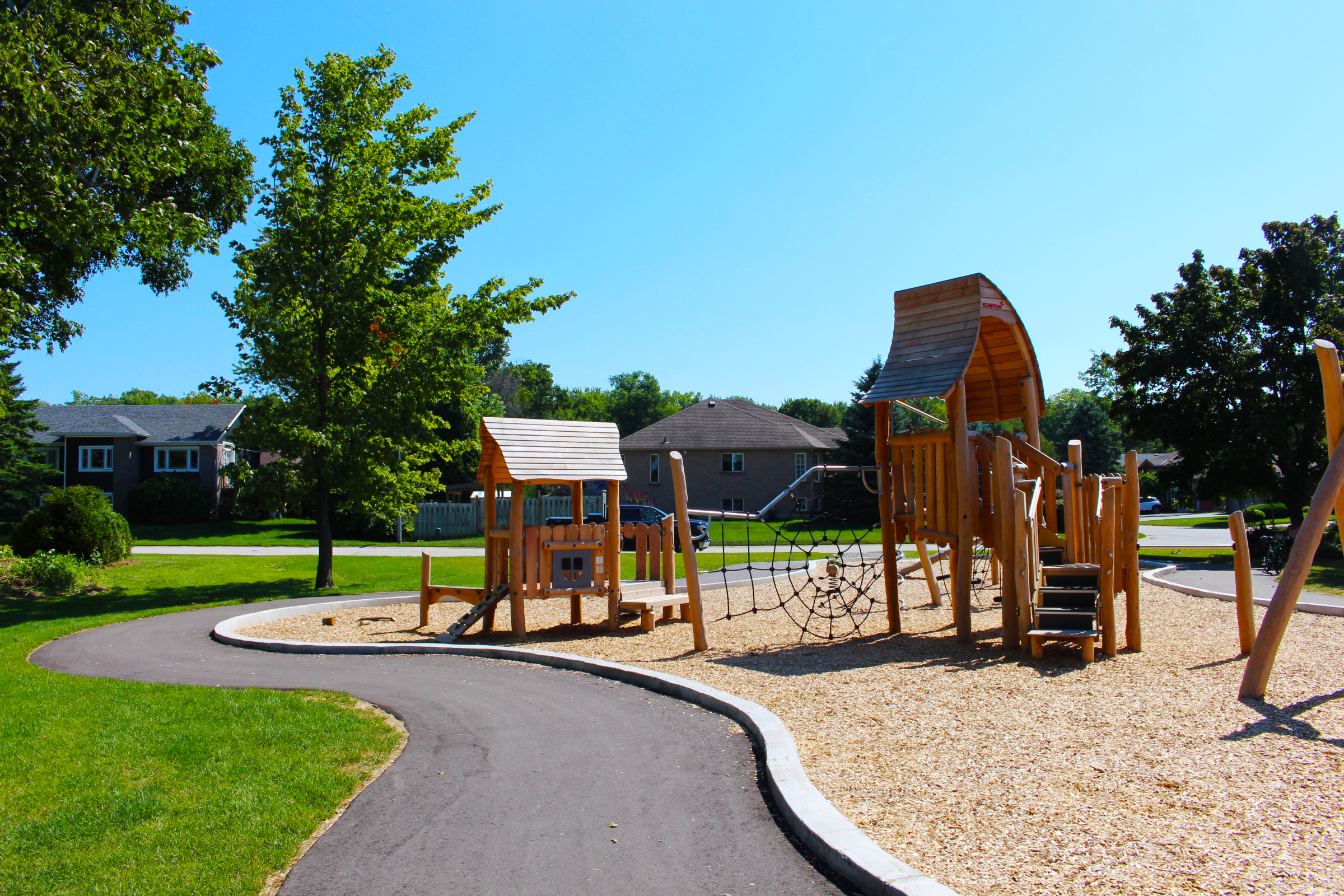 Sunny day at a playground with climbing equipment.