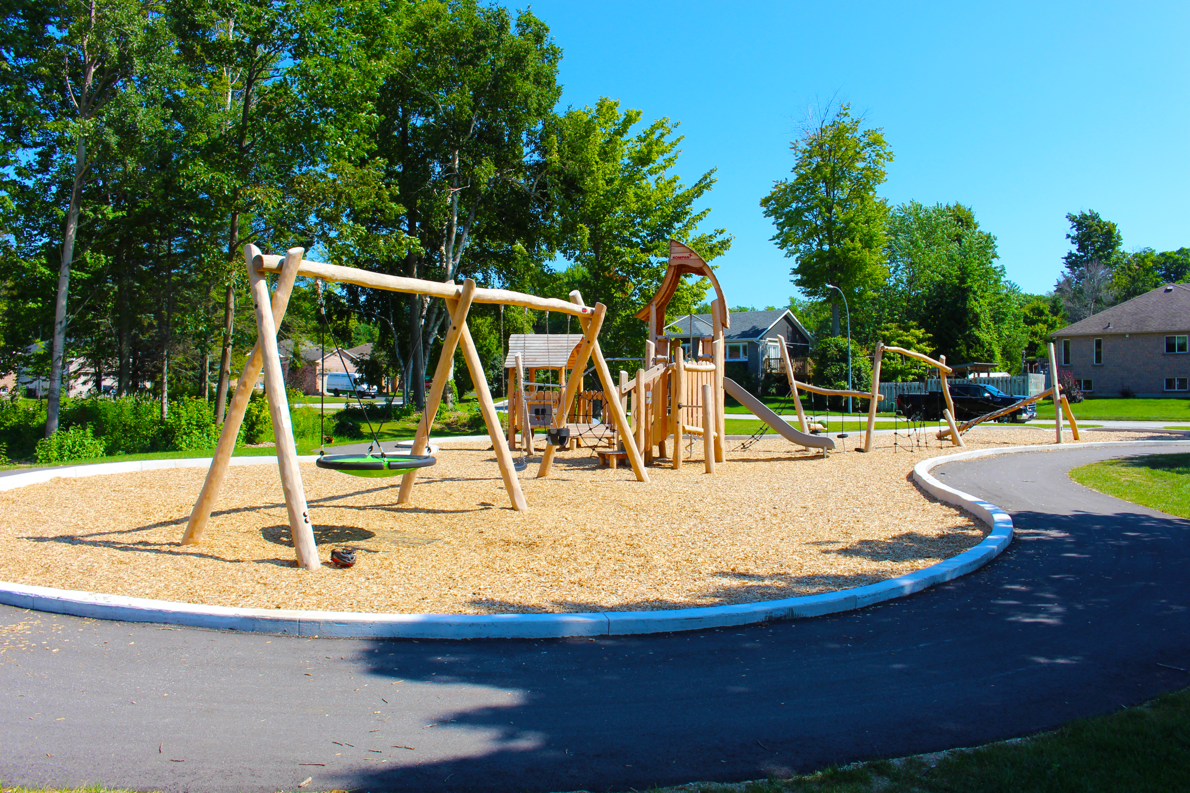 Sunny playground with swings and slide