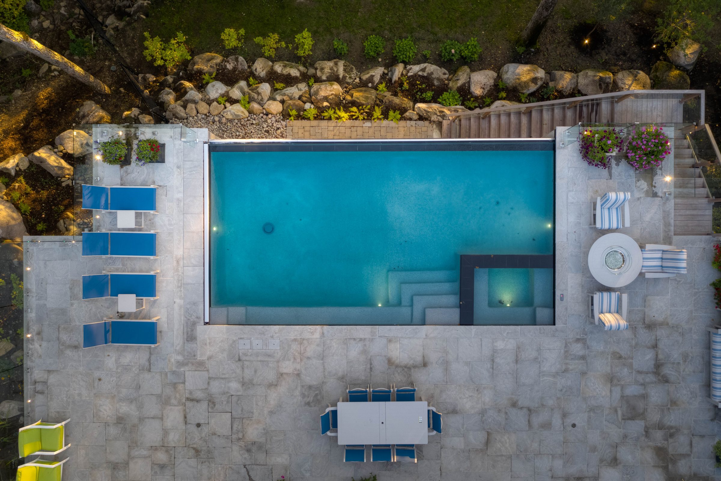 Aerial view of luxurious backyard pool and patio.