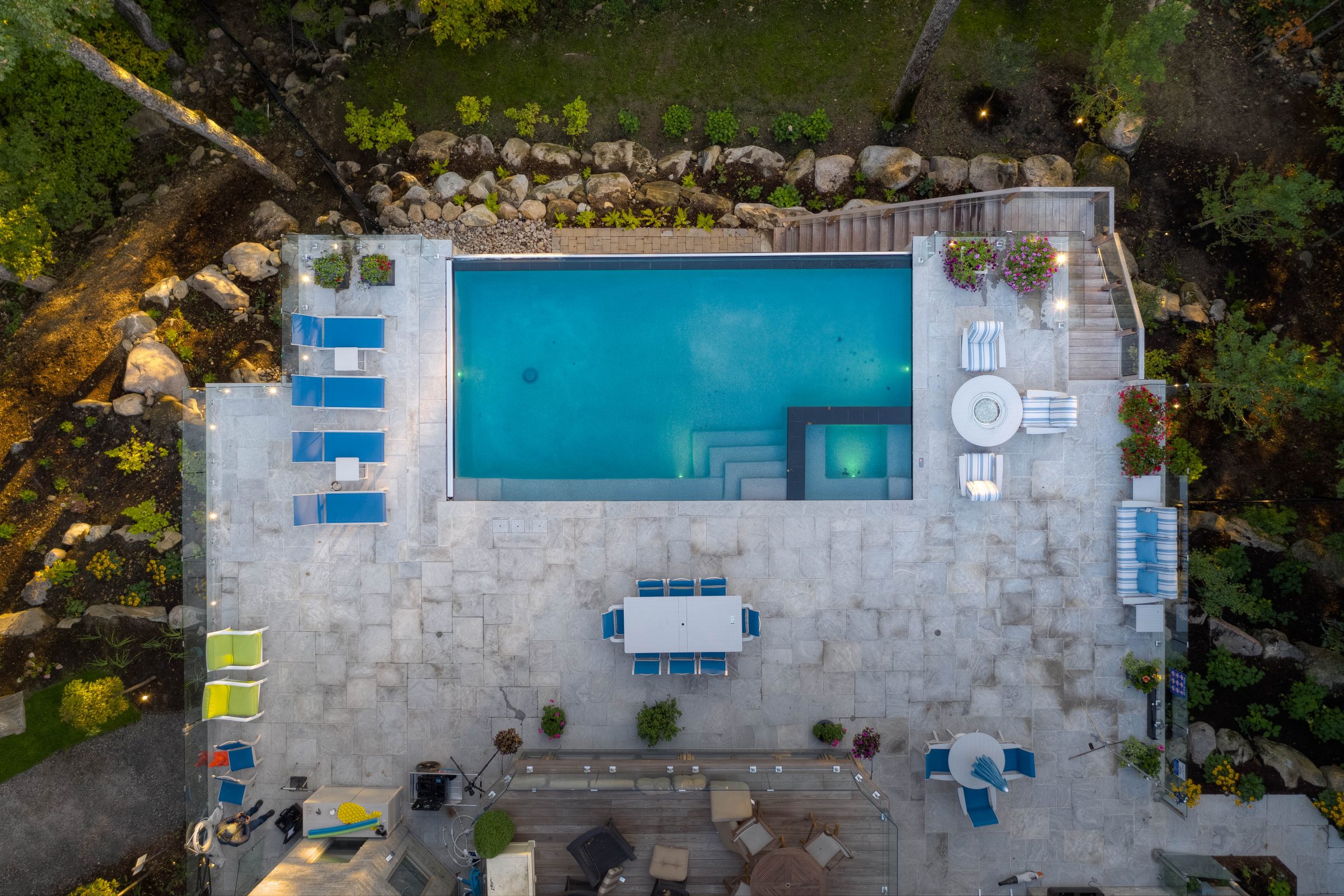 Aerial view of luxury pool and patio area.