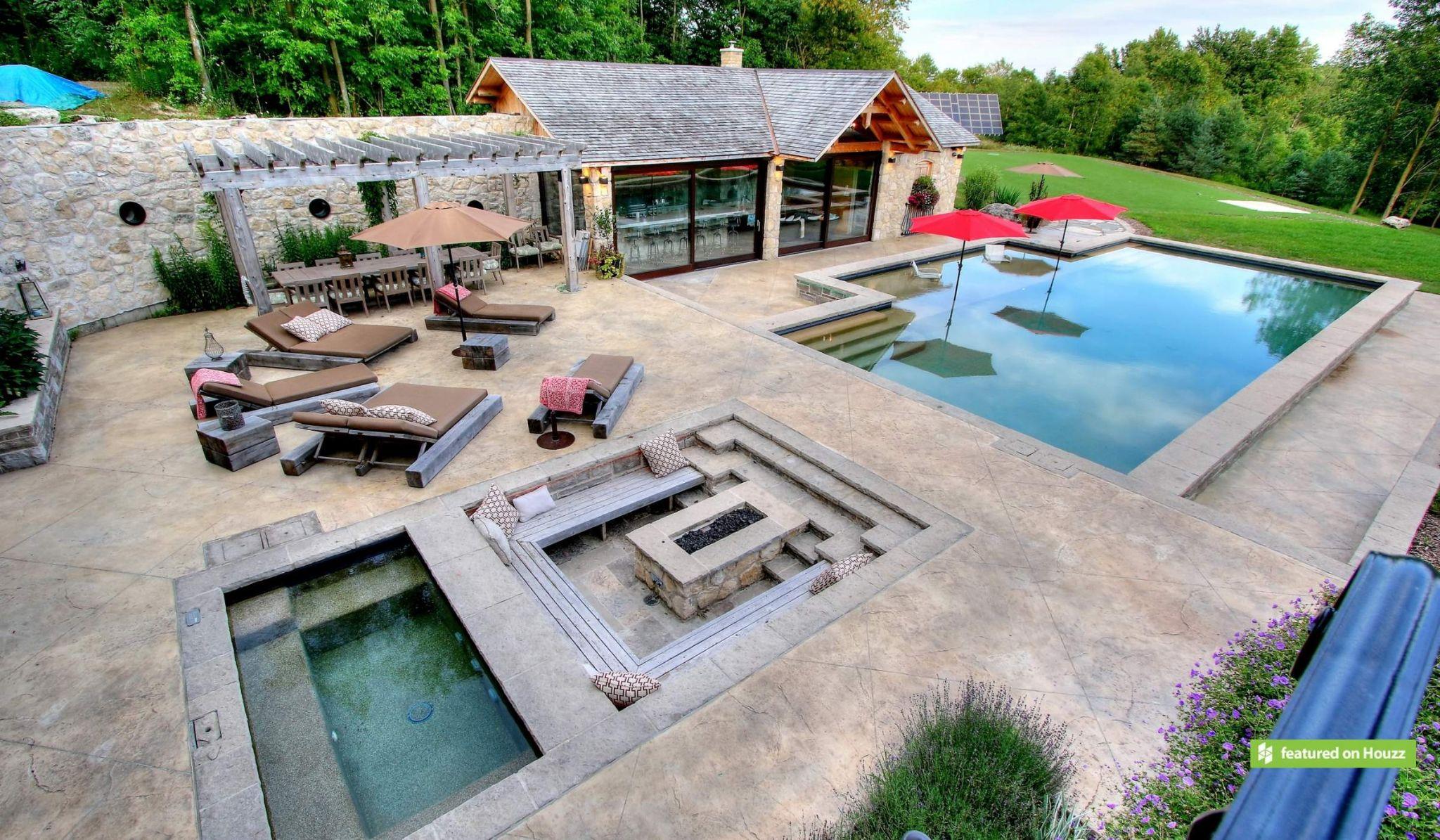 Luxury backyard with pool, fire pit, and outdoor seating area